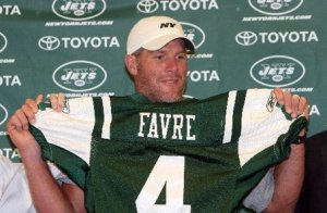 August 7, 2008 - Jets quarterback Brett Favre holds up his new jersey before Thursday night's preseason game against the Cleveland Browns at Cleveland Stadium.